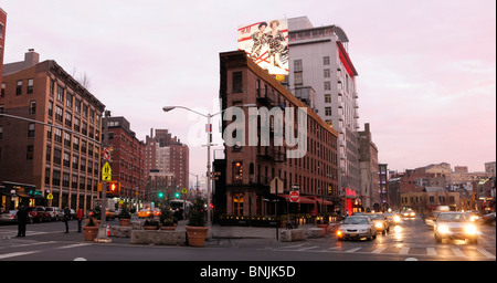 9th Avenue with The Gansevoort Hotel Meatpacking District Manhattan New York USA street lights traffic city travel american Stock Photo