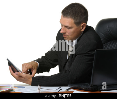 The businessman on a workplace considers on the calculator. It is isolated on a white background Stock Photo