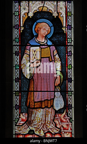 A stained glass window by Frank Holt depicting the Martyrdom of Saint Laurence, burned on a griddle of iron Stock Photo