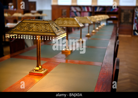 Big and old reading room shot with high depth of field DOF. Focus on the front lamp Stock Photo