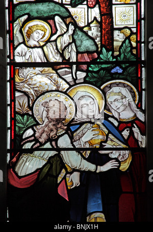 A stained glass window depicting The Three Maries and an Angel at the Resurrection of Jesus Stock Photo