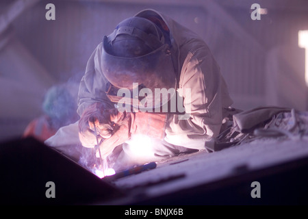 Welder working in a copper mine Stock Photo