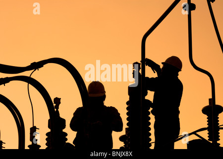 Workers seting up an electric sub station in Santiago de Chile Stock Photo