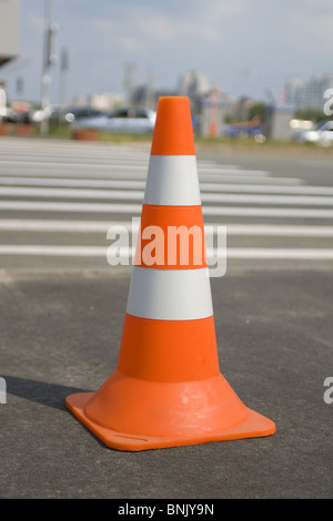 Close up of one traffic cone on a road with path Stock Photo