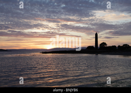 Sunset over the Pencil Monument in the seaside town of Largs on the Firth of Clyde, North Ayrshire, Scotland, UK Stock Photo