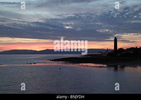 Sunset over the Pencil Monument in the seaside town of Largs on the Firth of Clyde, North Ayrshire, Scotland, UK Stock Photo