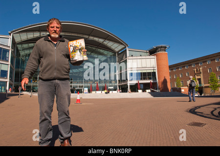 A Big Issue seller at the Forum in Norwich , Norfolk , England , Great Britain , Uk Stock Photo