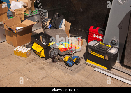 A workmans tools laying out on the street during a building job in the Uk Stock Photo
