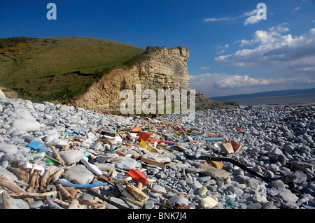 Rubbish and waste washed up on pebble beach near Southerndown Vale of Glamorgan Heritage Coast South Wales UK Stock Photo