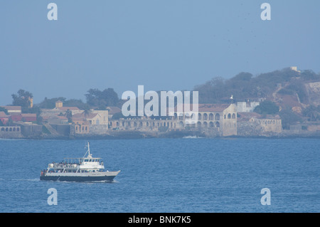 Africa, Senegal, Dakar. Local ferry in front of historic Ile De Goree (3 miles off the coast of Dakar) Stock Photo