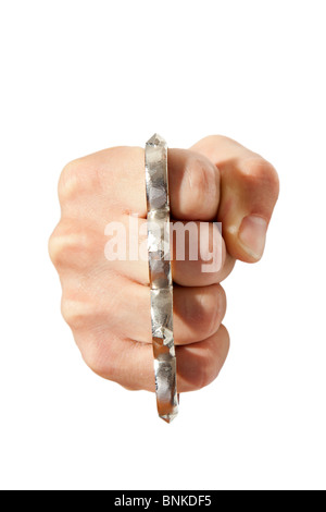 brass knuckles on fist Stock Photo