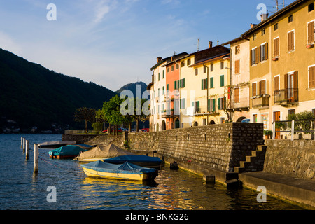 Brusino-Arsizio Switzerland canton Ticino lake Lago di Lugano Lake of Lugano mountain village houses homes evening light spring Stock Photo