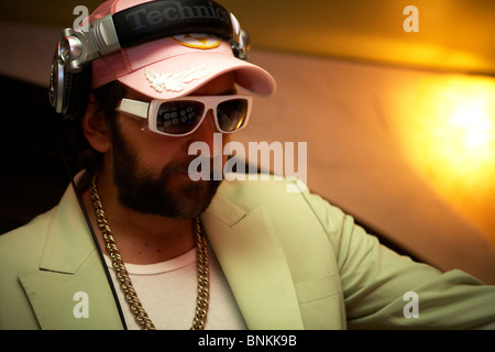 A London party DJ dressed in white with a retro look Stock Photo