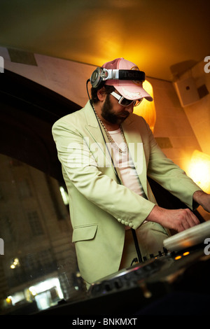 A London party DJ dressed in white with a retro look Stock Photo