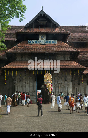 India Kerala Thrissur an harnessed elephant going out of the Shiva temple during the Pooram Elephant Festival Stock Photo