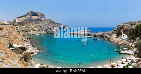 Panoramic view of St Paul's Bay Beach with the Acropolis behind, Lindos, Rhodes, Greece Stock Photo