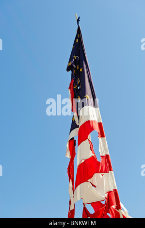 A battered Civil War era American flag flies above a Civil War Reenactment event in Oregon. Stock Photo