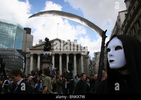 Protester dressed as the grim reaper with sythe over The Bank of England during G20 protests, London, UK Stock Photo