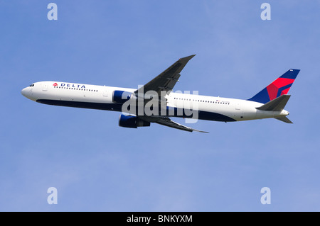 Boeing 767 operated by Delta Airlines climbing out from London Heathrow Airport, UK Stock Photo