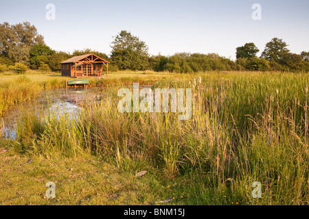 Large pond and summerhouse in the countryside, Wiltshire, England Stock Photo