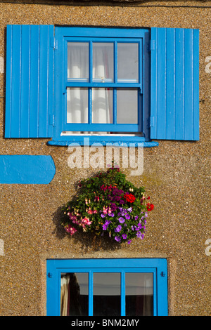 Blue trimmed windows of the historic Start Bay Inn, Torcross, Devon Stock Photo