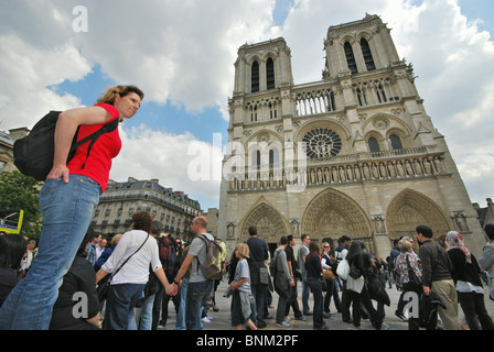 crowds of tourists in front of Notre Dame Paris France Stock Photo