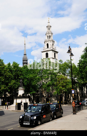 Black Cabs parked in The Strand near Aldwych,with Church of St Mary Le Strand London, England, UK Stock Photo