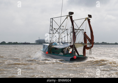 Local fisherman returning from skimming during 2010 BP oil spill Stock Photo