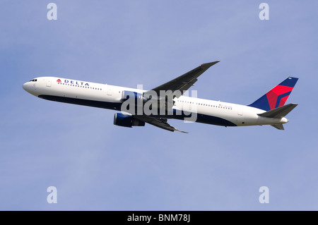 Boeing 767 operated by Delta Airlines climbing out from London Heathrow Airport, UK. Stock Photo