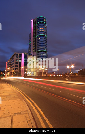 Traffic trails next to Bridgewater Place, one of the tallest buildings in Leeds, West Yorkshire, England Stock Photo