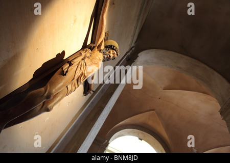 crucifix on church wall Stock Photo