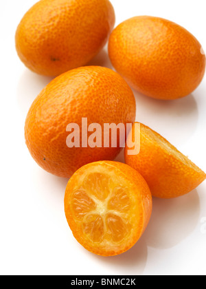 Fresh ripe kumquats on a white background Stock Photo