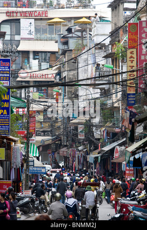 Vietnam Asia Far East Hanoi town city street traffic motorcycles motorbikes waste gases environmental pollution people people Stock Photo