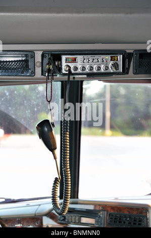 A cb radio in the cab of a semi truck Stock Photo