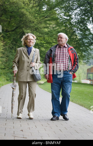 Active senior couple in the park Stock Photo - Alamy