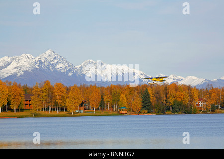 Float plane taking off from Lake Lucille in Wasilla, SC, Alaska Stock Photo