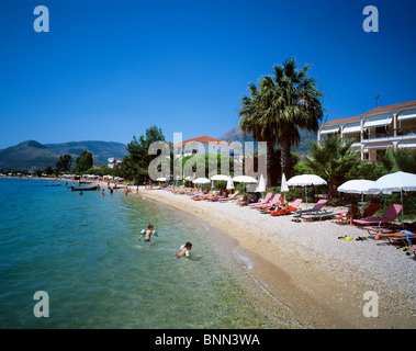 Beach scene at the picturesque resort of Nidri on the Greek island of Lefkas Stock Photo