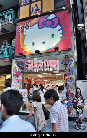 Entrance of Sanrio 'Hello Kitty' giftstore and Japanese girl in Kimono passing by (Tokyo, Japan) Stock Photo