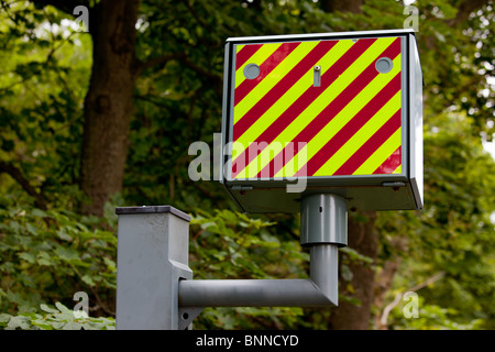 The back of a GATSO speed camera pointing up a road Stock Photo