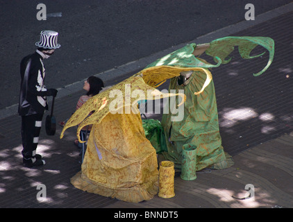 TWO FAIRIES STREET ARTISTS HUMAN STATUES IN FANCY DRESS ON LAS RAMBLAS BARCELONA SPAIN EUROPE Stock Photo