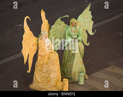 TWO FAIRIES STREET ARTISTS HUMAN STATUES IN FANCY DRESS ON LAS RAMBLAS BARCELONA SPAIN EUROPE Stock Photo