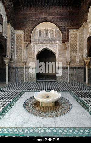 Marble Fountain, Interior Tiled Court or Courtyard of the Attarine Medersa (1323-25) or Medresse, aka Al-Attarine Madrasa, Medina, Fez, Morocco Stock Photo