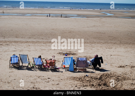 Deckchairs on Blackpool beach in the summer Stock Photo