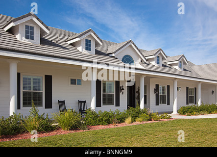 Beautiful House Facade Against a Blue Sky. Stock Photo