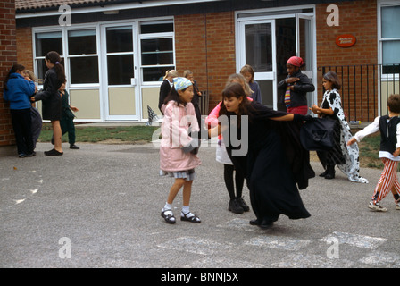 Primary School Children Dressed For Book Day Playing In Playground Stock Photo