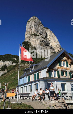 Switzerland swiss scenery Alpstein mountains walking hiking hut mountain house alpine hut rock cliff mountain restaurant Stock Photo