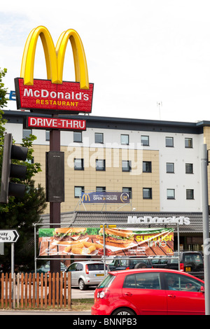 McDonald's sign and company logo on post with drive-thru signat West Quay, Southampton Stock Photo