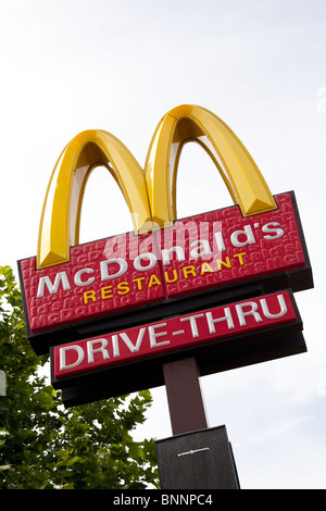 McDonald's sign and company logo on post with drive-thru signat West Quay, Southampton Stock Photo