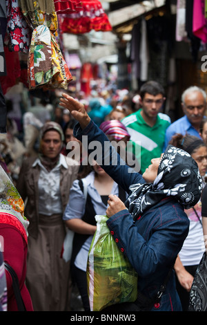 Mulsim woman shopping in the bazaar in Trabzon, Turkey Stock Photo