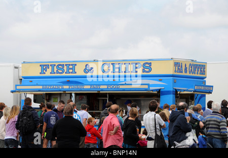 customers queuing at a mobile fish and chips outlet at a country fair in lancashire, uk Stock Photo